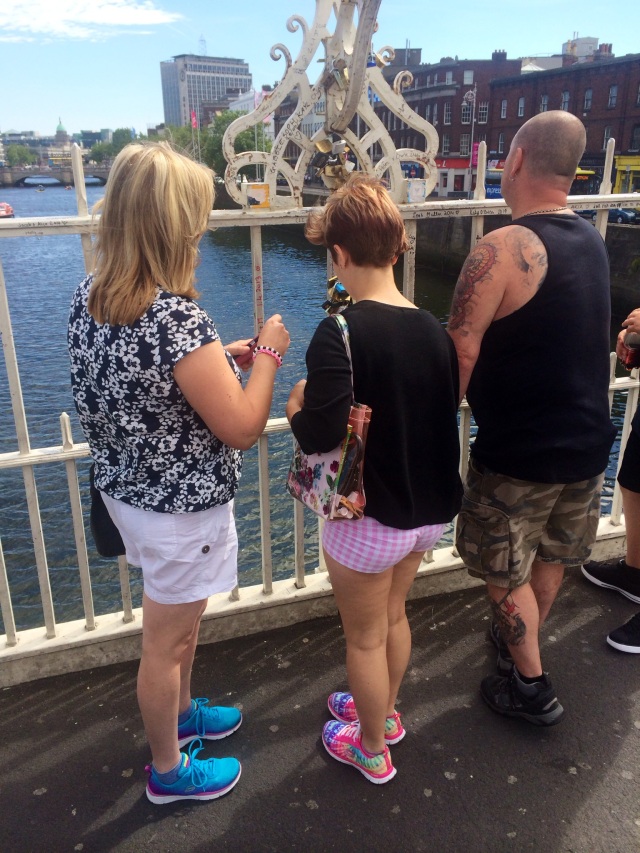 tourists looking at locks